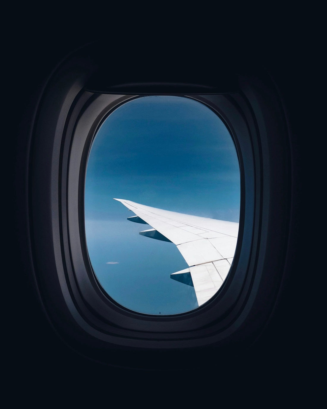Aircraft wing viewed through a window