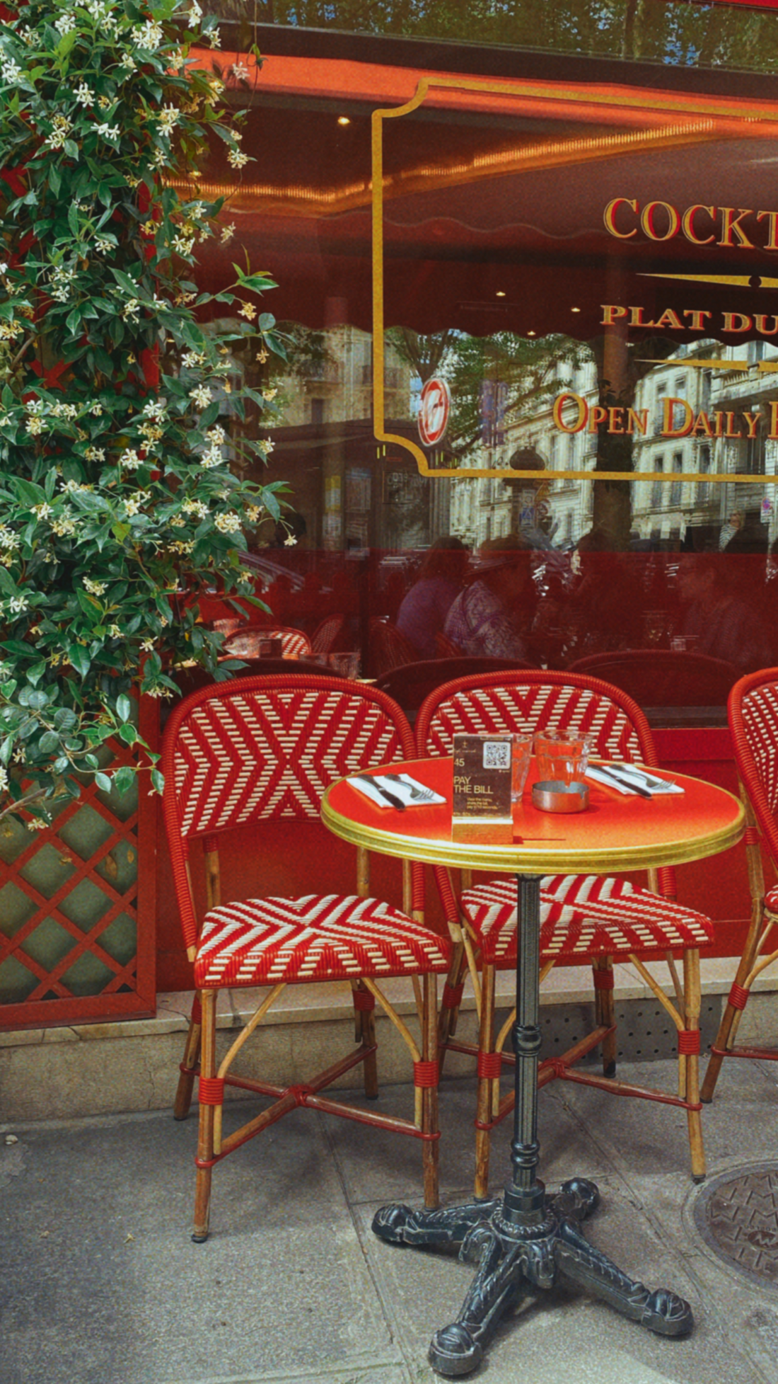 Paris café terrace with red chairs
